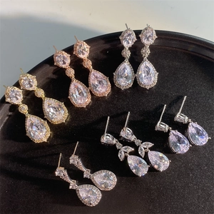 Elegant pear cut zircon earrings in silver, gold, and rose gold finishes for brides