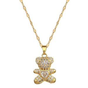Luxurious gold bear necklace with sparkling white zircons and a central heart-shaped stone