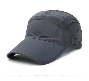 Detail of dark grey quick-dry baseball cap featuring SDR logo and ripstop texture fabric