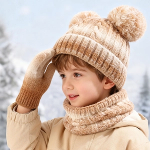 Close-up of kids winter knit set with beanie, scarf and gloves in gradient tie-dye