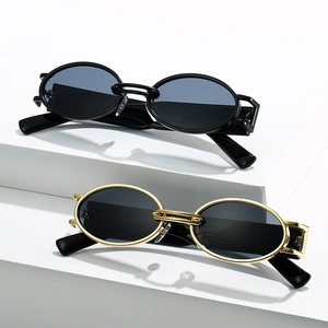 Retro oval frame sunglasses in black and gold metal finish for a chic summer look