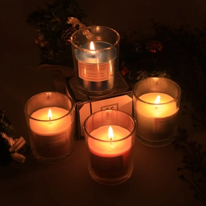 Nordic luxury large scented candles in transparent glass jars with festive pine decor