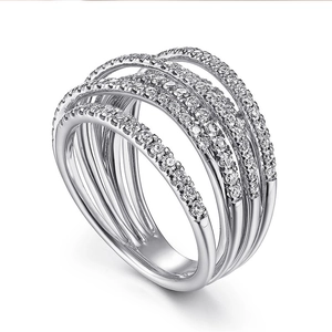 Macro detail of multi-layer silver wide ring featuring sparkling pave-set cubic zirconia