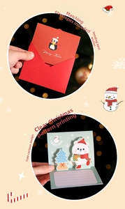 Detail of 3D Christmas card showing pop-up polar bear and penguin design with red envelope