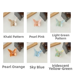 Detailed grid view of butterfly claw clips in various acetate patterns and colors