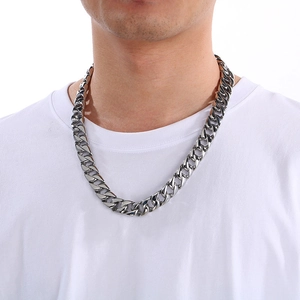 Classic 15mm silver titanium steel Cuban link chain necklace for men shown on a model