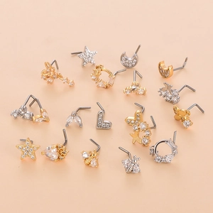 17-piece stainless steel nose stud set with gold and silver butterfly and star designs