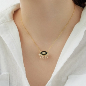 Elegant model wearing a gold plated S925 sterling silver evil eye necklace with zircon