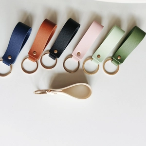 Minimalist business PU leather keychains in various colors with golden metal rings