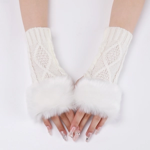 Close-up of white cable knit fingerless gloves with luxurious faux fur trim and wrist detail