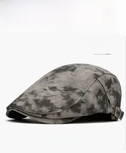 Detail view of grey tie-dye ivy cap showing thick fabric texture and metal side buckle