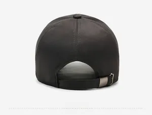 Detail view of the adjustable back strap and metal buckle on this gray baseball cap