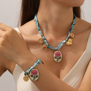 Blue tie-dye fabric chain necklace and bracelet set with pink rose compass pendant