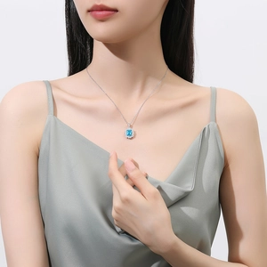 Elegant S925 sterling silver necklace featuring 2.5ct oval blue topaz halo pendant