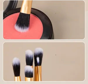 Close-up of soft synthetic brush bristles with gold ferrule and dual-ended makeup brush