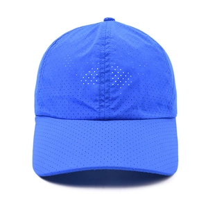 Detail of blue sports baseball cap featuring laser-cut ventilation holes and quick-dry mesh fabric