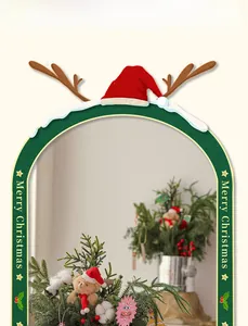 Detail of Christmas tree ornament with brown bear, red berries, and cotton boll