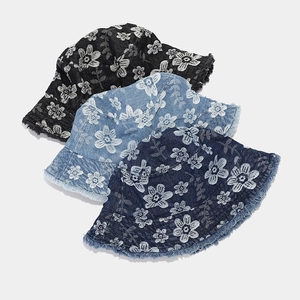 Three retro floral denim bucket hats in black and blue with fringe trim edge