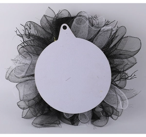 Rear view of Halloween wreath showing black mesh material and hanging wooden backplate