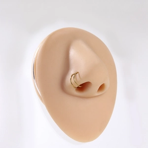 8mm gold double-layered stainless steel nose ring shown on a silicone model display