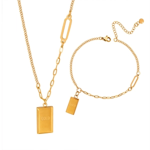 Golden square pendant necklace and bracelet set with GOLD engraving on white background