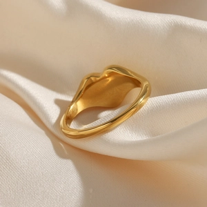 Irregular 18k gold plated stainless steel ring with black enamel drip design
