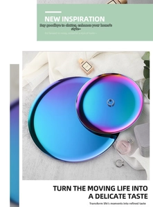 Detail of round stainless steel trays with iridescent purple gradient for jewelry storage