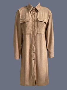 Detail of khaki corduroy maxi shirt dress showing fabric texture and chest pockets
