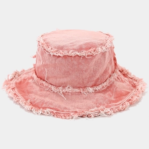 Detail of pink washed denim bucket hat featuring vintage frayed edges and raw fringe trim