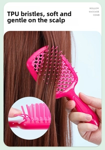 Close-up of flexible TPU bristles on a hollow rose pink massage hair comb for scalp care