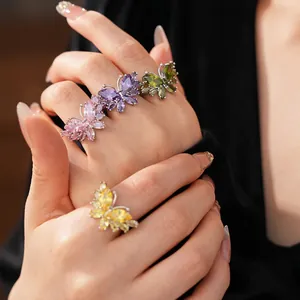 Chic set of colorful butterfly zircon open rings on model's hand with silver finish