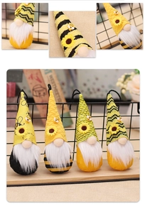 Detailed view of four handmade bee festival gnomes with sunflower and striped knit patterns