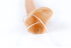 Close-up of realistic flesh-colored pointed elf ears with elastic strap for cosplay