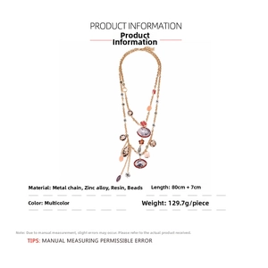 Detailed view of multilayer bohemian necklace specs, metal chain, and resin bead accents