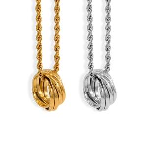 Minimalist interlocking ring pendant necklaces in gold and silver finishes on rope chains