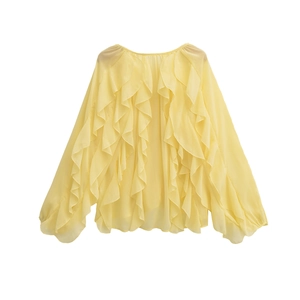 Flat lay view of a yellow ruffle long sleeve chiffon shirt with translucent fabric
