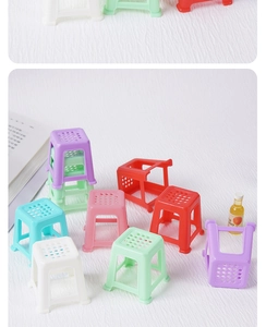 Detailed view of colorful miniature plastic dollhouse stools in assorted vibrant shades