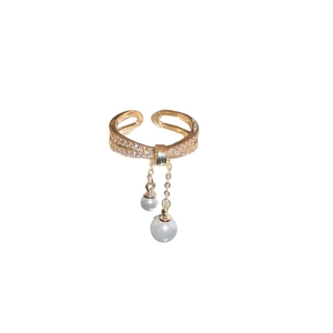 Gold plated double layer ring with sparkling cubic zirconia and dangling pearl tassels