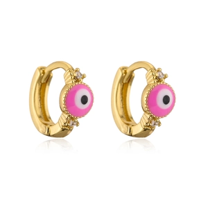Macro view of gold-plated pink evil eye earrings with white cubic zirconia accents