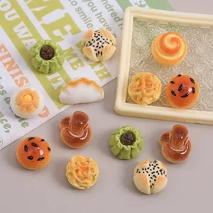 Detailed view of assorted 3D miniature resin food charms including buns and dumplings