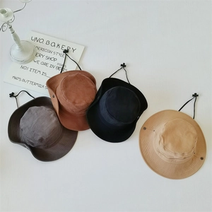 Outdoor sun hats in four neutral colors with adjustable chin straps and side snaps