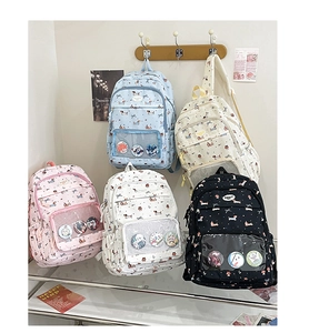 Multiple color variations of student backpacks featuring dachshund prints and clear pin pockets