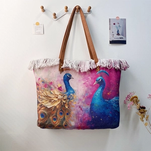 Large bohemian peacock print tote bag featuring white fringe trim and brown shoulder straps
