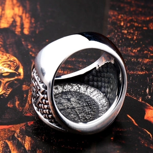 Macro view of vintage stainless steel Viking ring featuring textured inner band detail