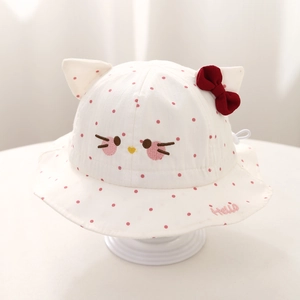 Detail of baby sun hat featuring embroidered cat face, 3D ears, and a red bow