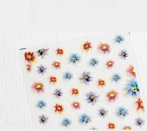 Macro shot of 5D ultra-thin nail stickers with colorful floral patterns and matte finish