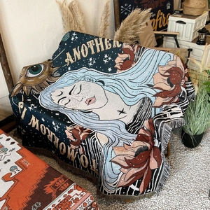 Bohemian woven picnic blanket with blue hair girl pattern and tassels on camping chair
