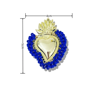 Handmade woven heart pendant with blue beads and golden metal flame detail 4x5cm