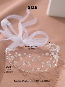 Detail view of crystal beaded bridal headband with size dimensions and mesh texture
