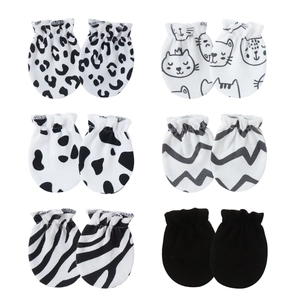 Detailed grid view of assorted cotton baby mittens with leopard, cow, and zebra patterns